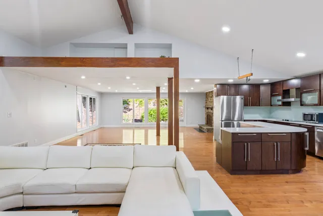 a view of a balcony with wooden floor