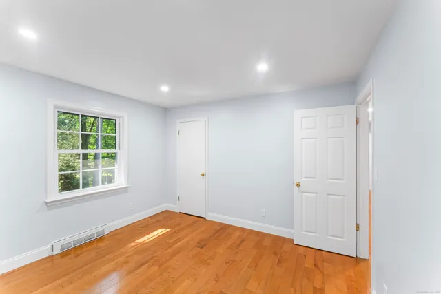 a bathroom with a toilet a sink and shower