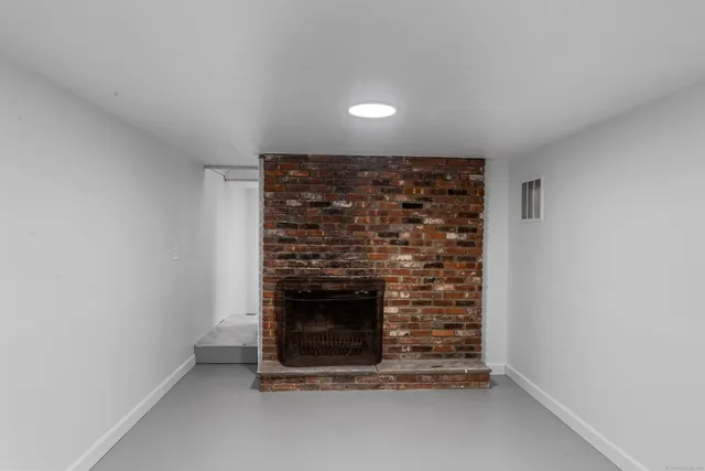 a view of a yard with table and chairs and wooden fence