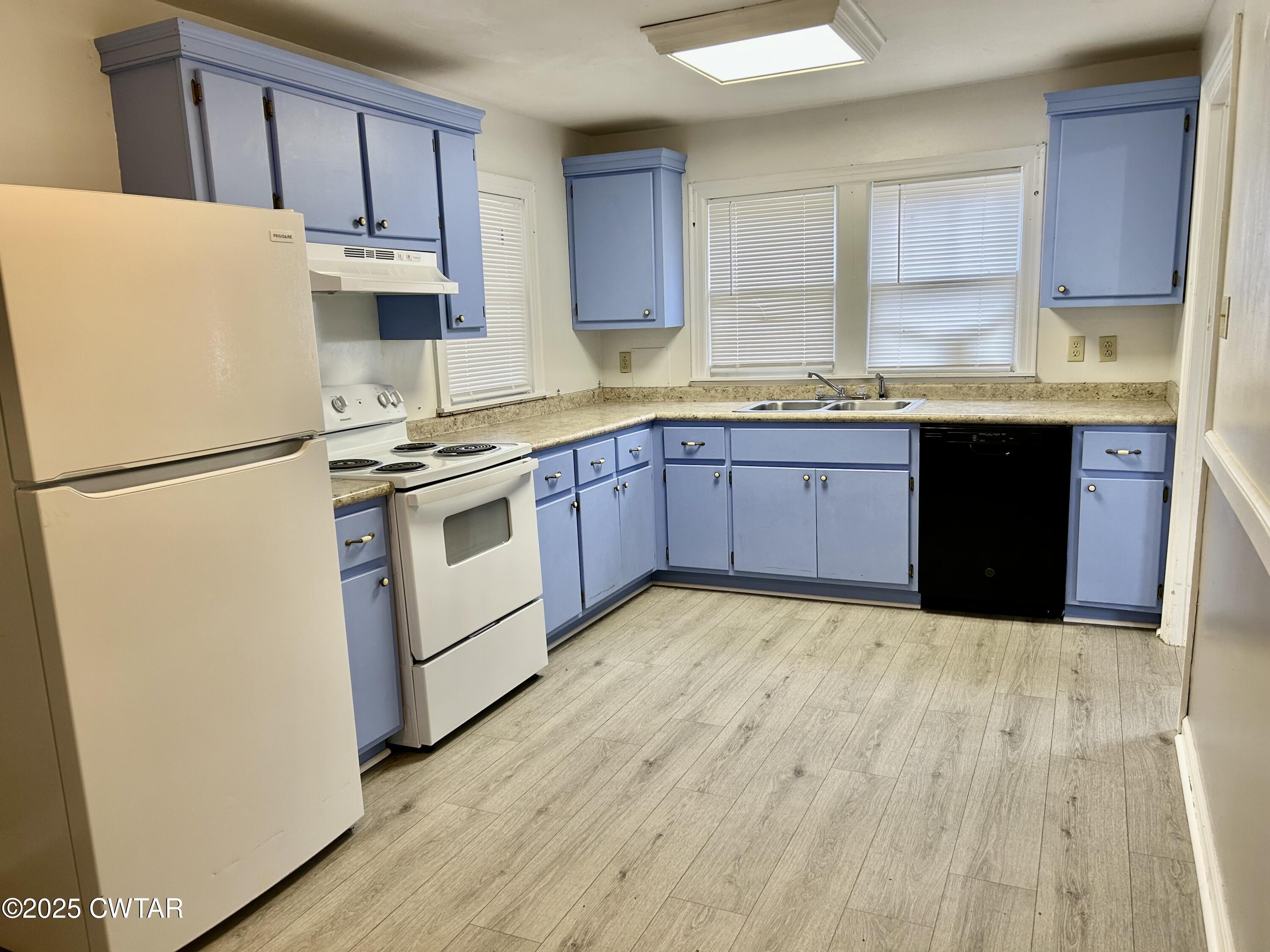 3281 Forked Deer Road Gates, TN 38037 - Photo 2 of 7 a kitchen with stainless steel appliances granite countertop a refrigerator sink and wooden cabinets