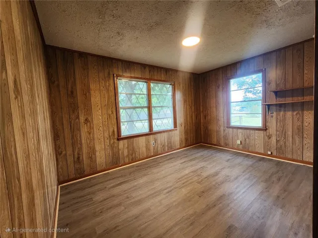 an empty room with wooden floor