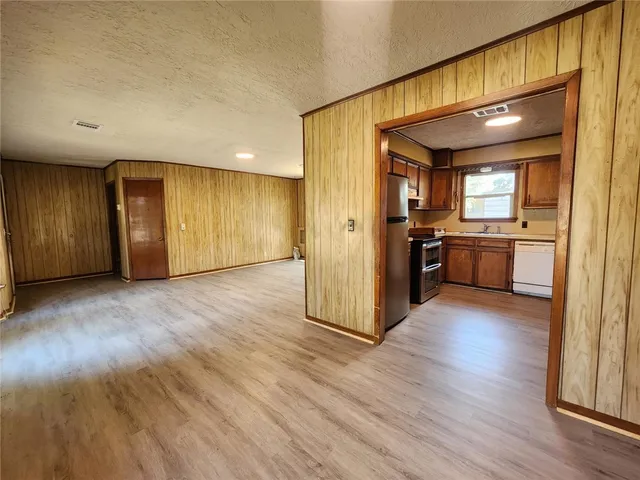 a view of a kitchen with a sink and a stove top oven