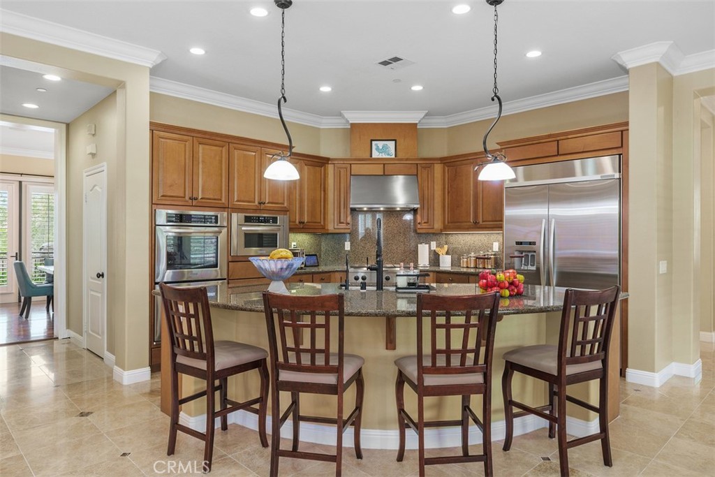 13337 Hunt Club Drive Rancho Cucamonga, CA 91739 - Photo 8 of 45 Kitchen with stainless steel appliances and granite island