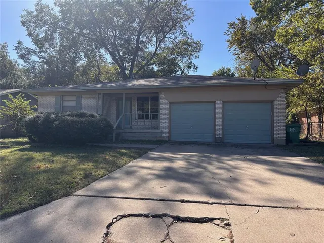 a view of staircase with a rug and a window