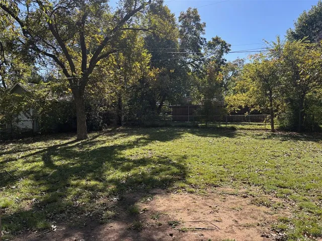 a view of a house with swimming pool and sitting area