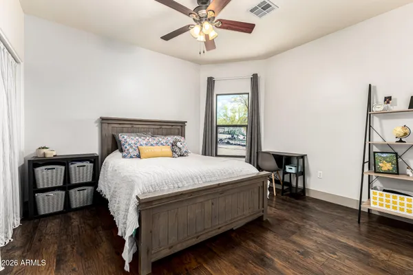 a bedroom with a bed and a table in it