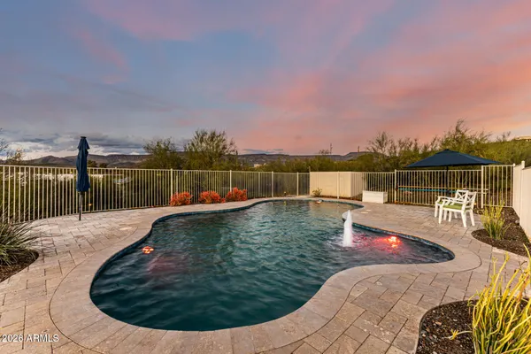 a view of a swimming pool with a lounge chair