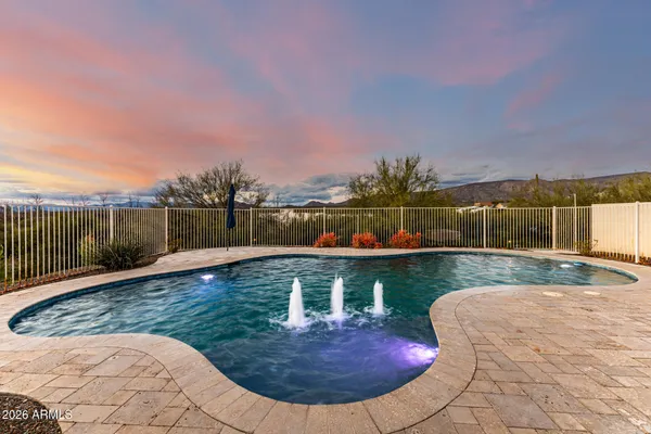 a view of a swimming pool with a patio