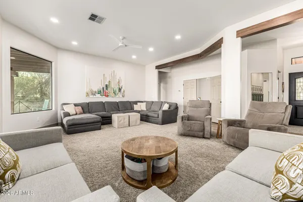 a living room with furniture and a large window