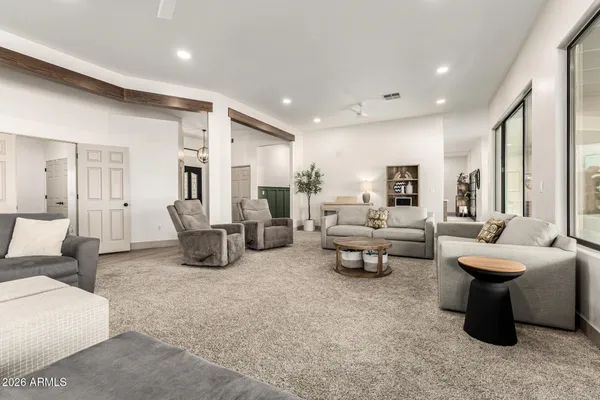 a living room with furniture and a large window