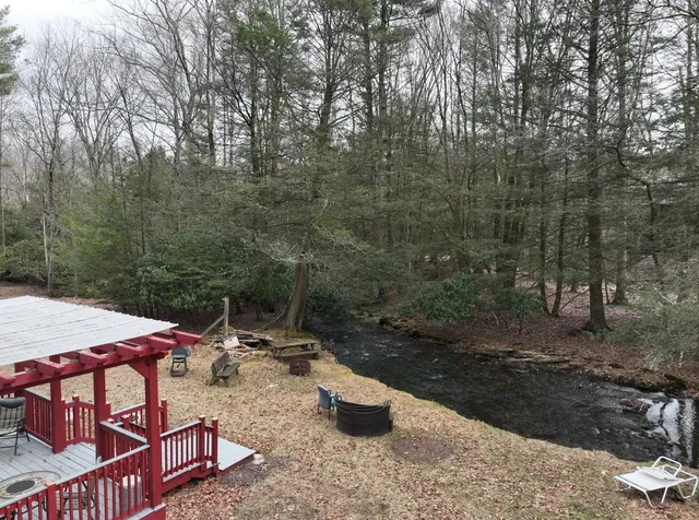 a view of a patio with chairs and table