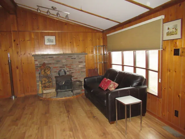 a living room with furniture windows and a fireplace