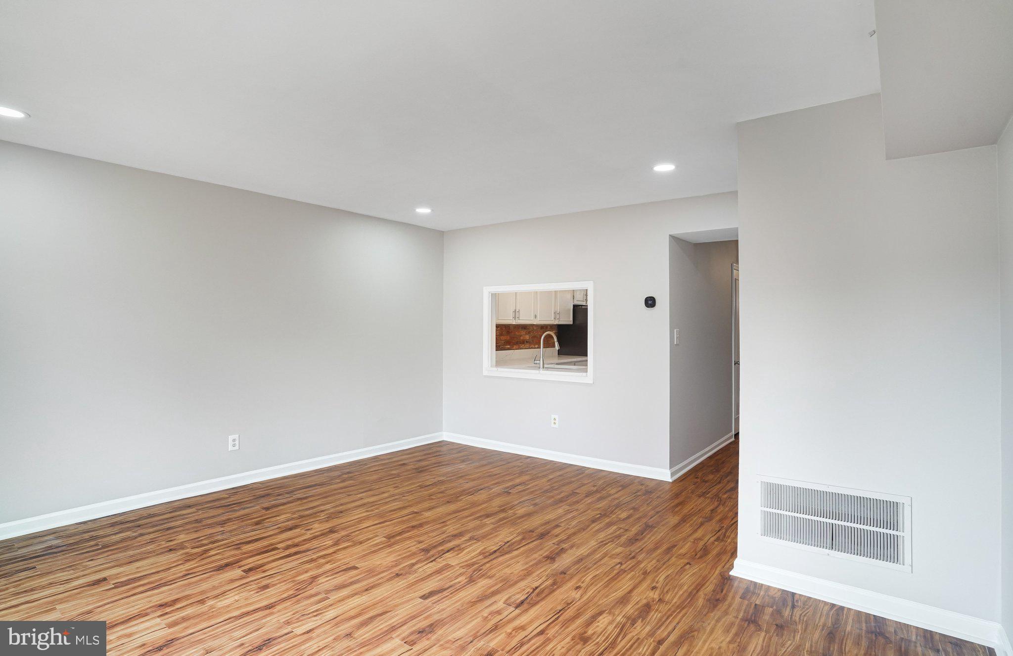 8396 Forrester Boulevard, Unit 555 Springfield, VA 22152 - Photo 10 of 24 a view of empty room with wooden floor