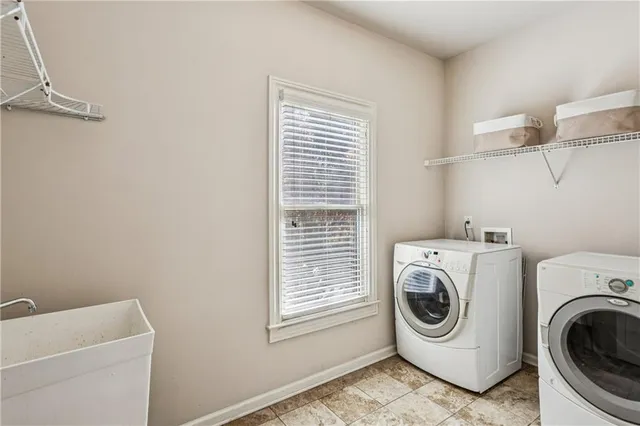 a utility room with dryer and washer