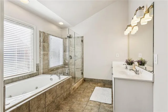 a bathroom with a bathtub and a sink