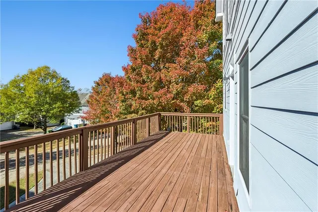 a view of balcony with wooden floor