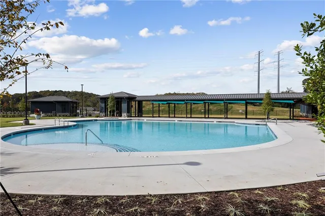 a view of a swimming pool with a yard