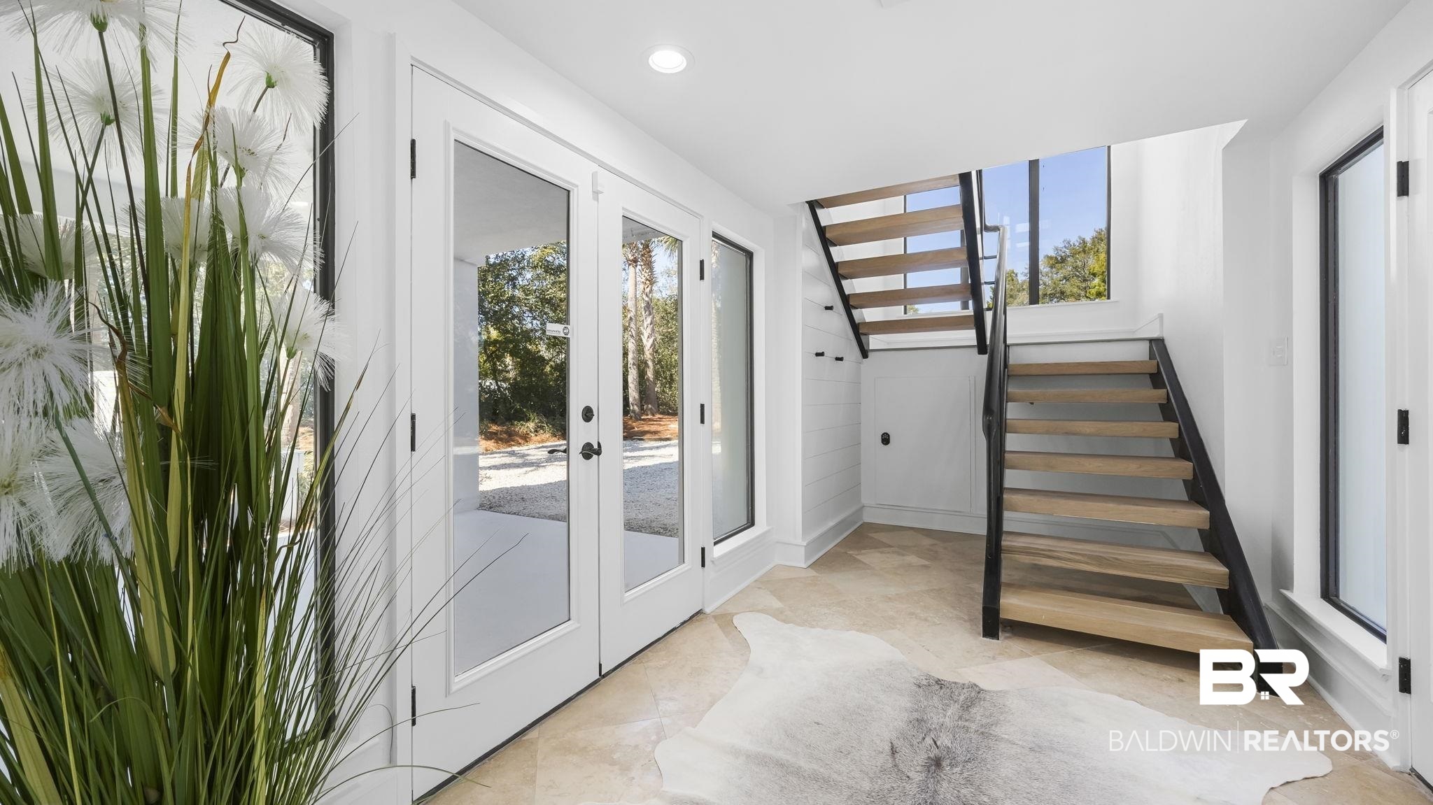 30194 River Road Orange Beach, AL 36561 - Photo 30 of 45 Doorway with french doors and recessed lighting
