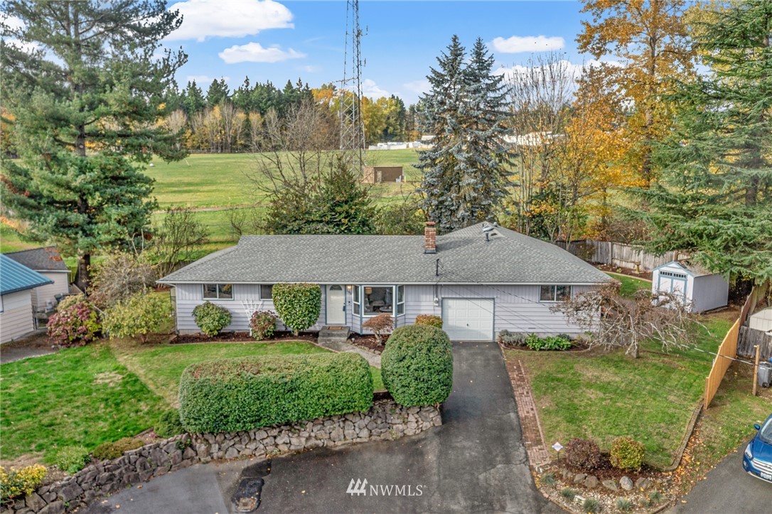 105 232nd Place Southwest Bothell, WA 98021 - Photo 1 of 39 a front view of a house with garden