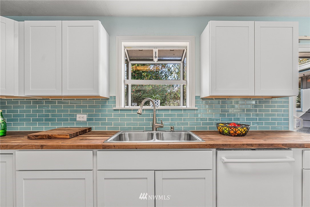 105 232nd Place Southwest Bothell, WA 98021 - Photo 13 of 39 a kitchen with a sink and a window