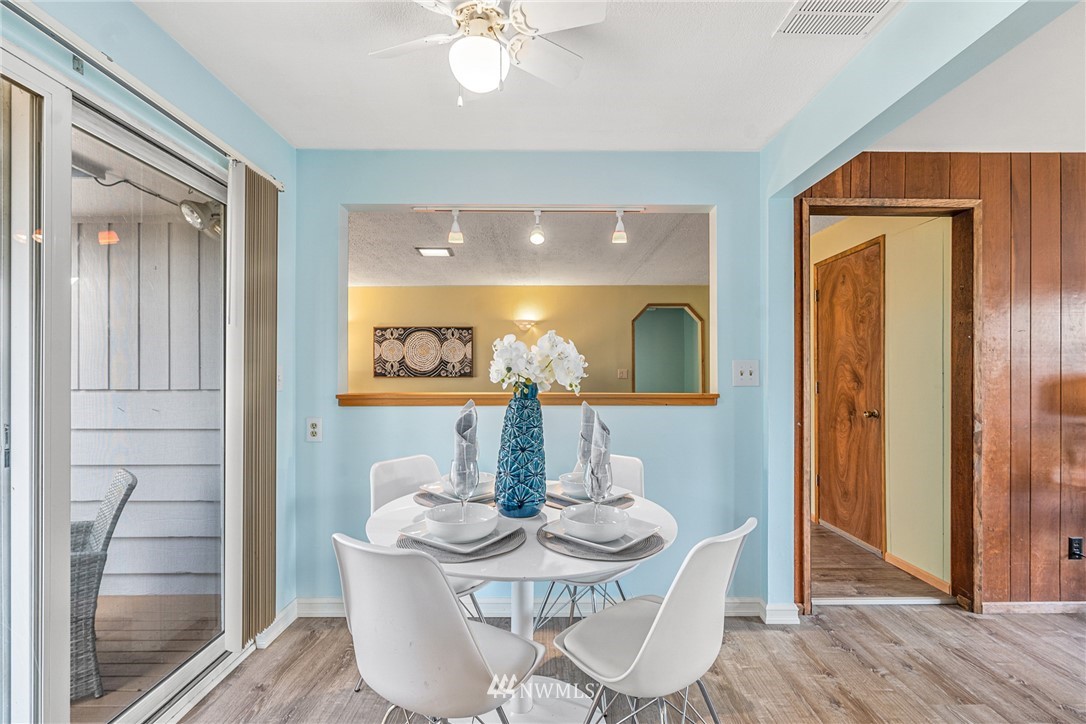 105 232nd Place Southwest Bothell, WA 98021 - Photo 16 of 39 a view of a dining room with furniture and wooden floor