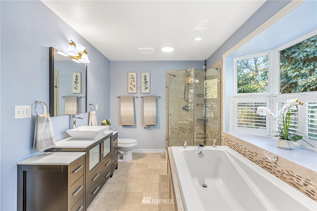 105 232nd Place Southwest Bothell, WA 98021 - Photo 23 of 39 a spacious bathroom with a granite countertop tub sink and mirror