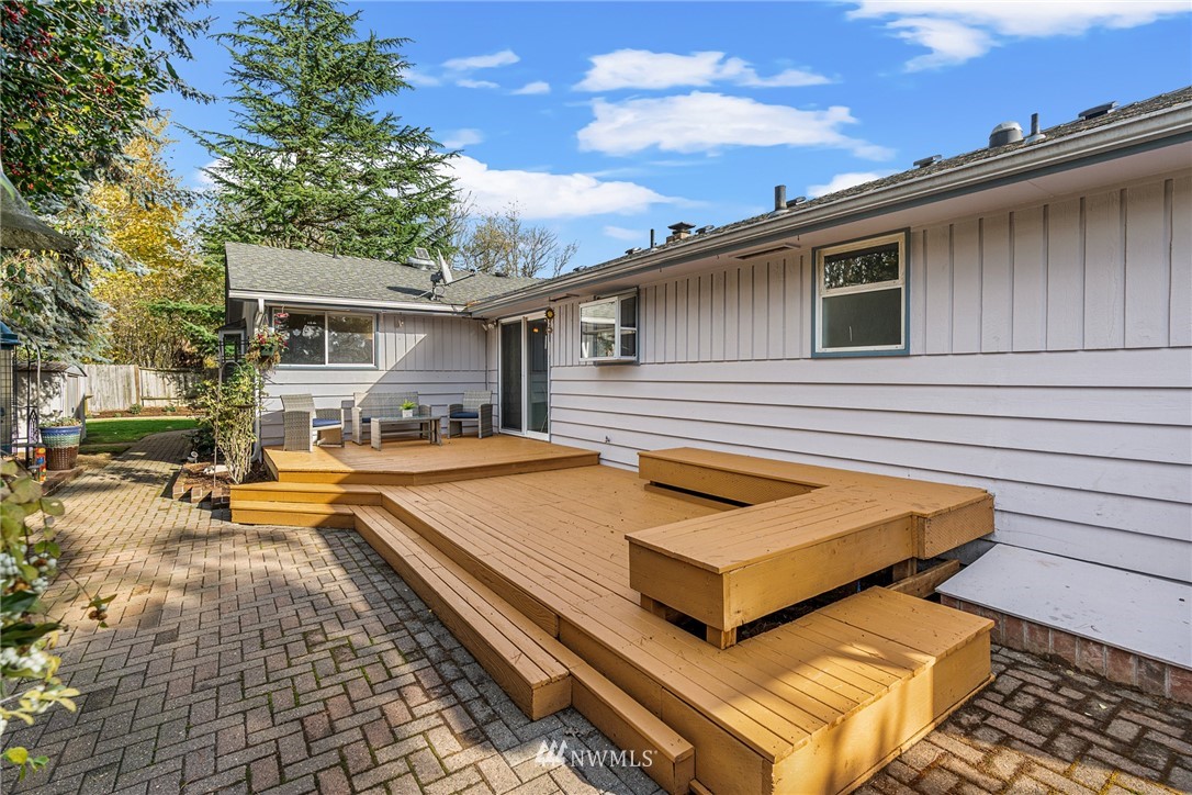 105 232nd Place Southwest Bothell, WA 98021 - Photo 30 of 39 a backyard of a house with yard and outdoor seating