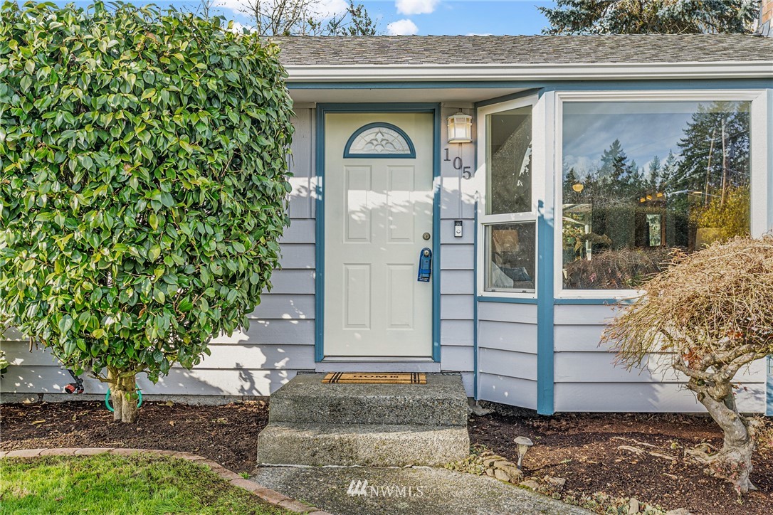 105 232nd Place Southwest Bothell, WA 98021 - Photo 4 of 39 a front view of a house with a garden