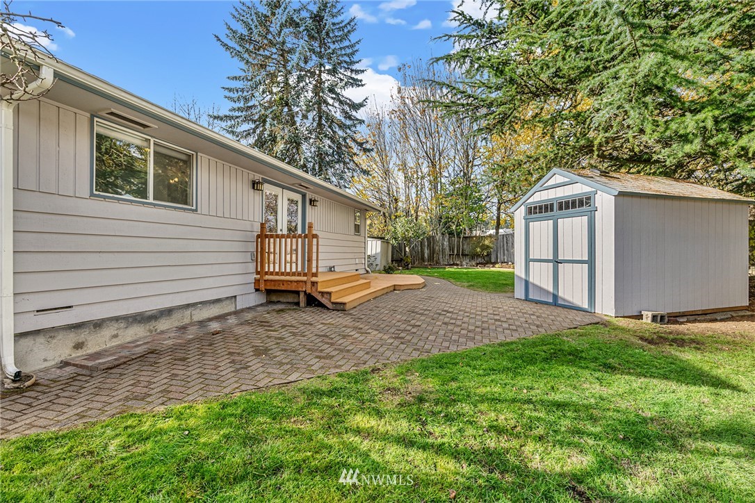 105 232nd Place Southwest Bothell, WA 98021 - Photo 35 of 39 a view of a backyard with a large tree