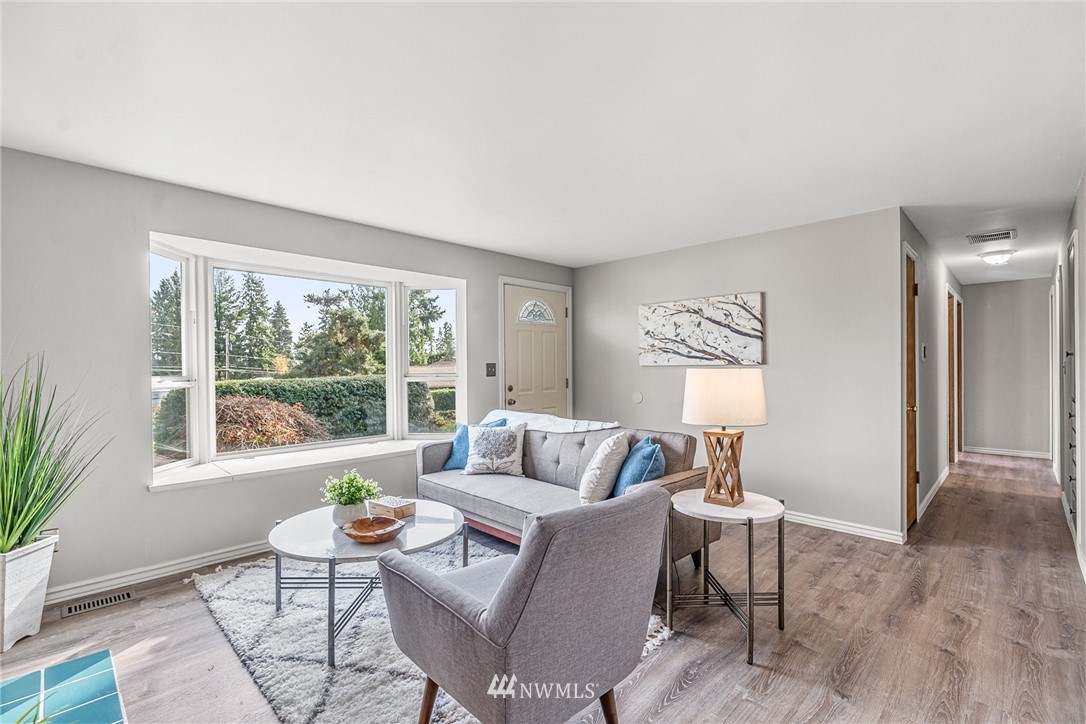 105 232nd Place Southwest Bothell, WA 98021 - Photo 10 of 39 a living room with furniture and a large window