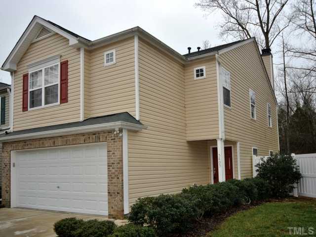 5805 Ricker Road Raleigh, NC 27610 - Photo 1 of 12 a view of a house with a yard and garage