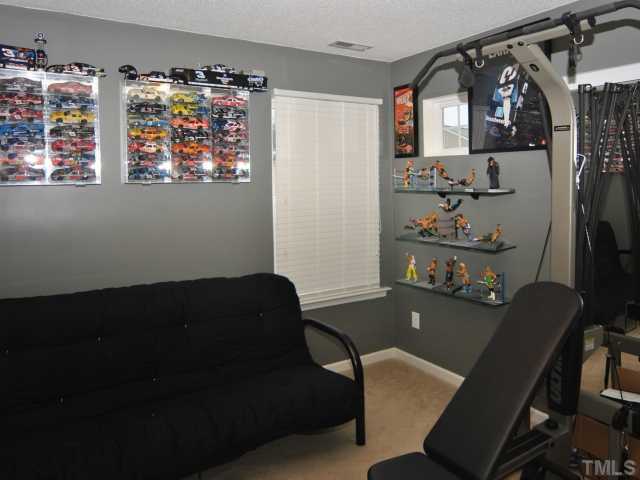 5805 Ricker Road Raleigh, NC 27610 - Photo 9 of 12 a view of a workspace with furniture