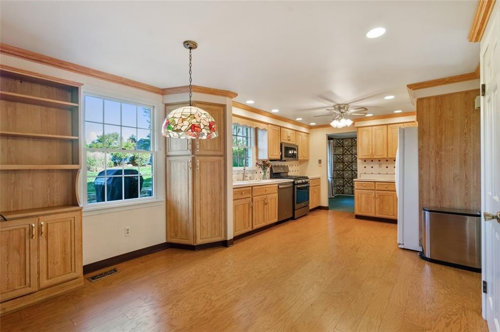 1439 Old Meadow Road Pittsburgh, PA 15241 - Photo 9 of 27 Table space beneath the hanging light fixture.
