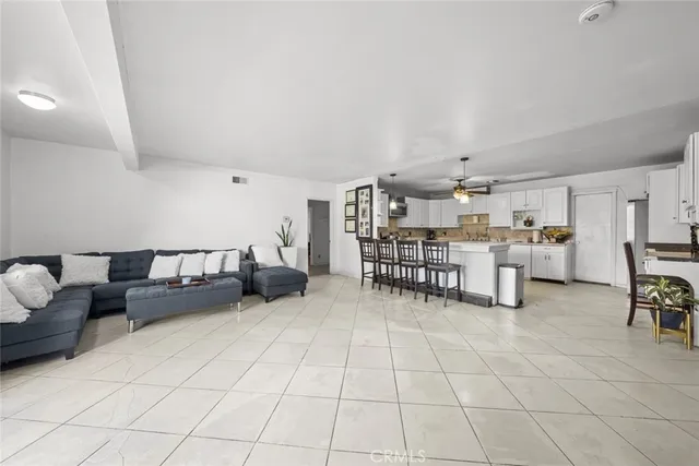 a room with furniture and white walls