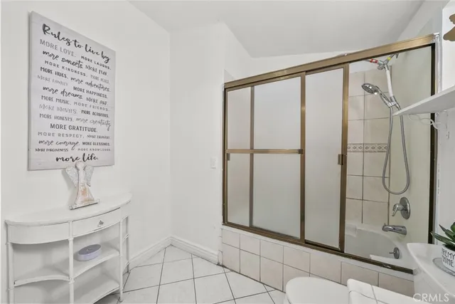 a bathroom with a shower and a sink