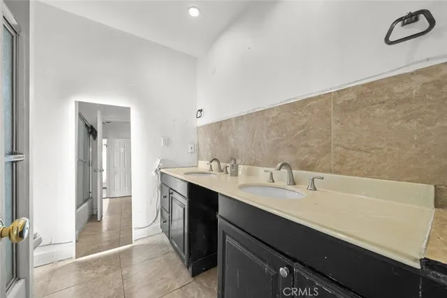 a bathroom with a sink a vanity and a mirror