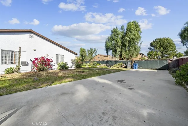 a swimming pool with outdoor seating and yard