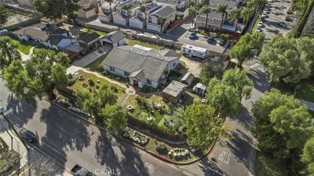 an aerial view of houses with outdoor space