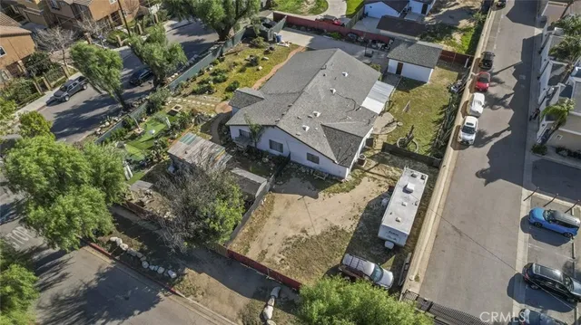 an aerial view of residential house and green space