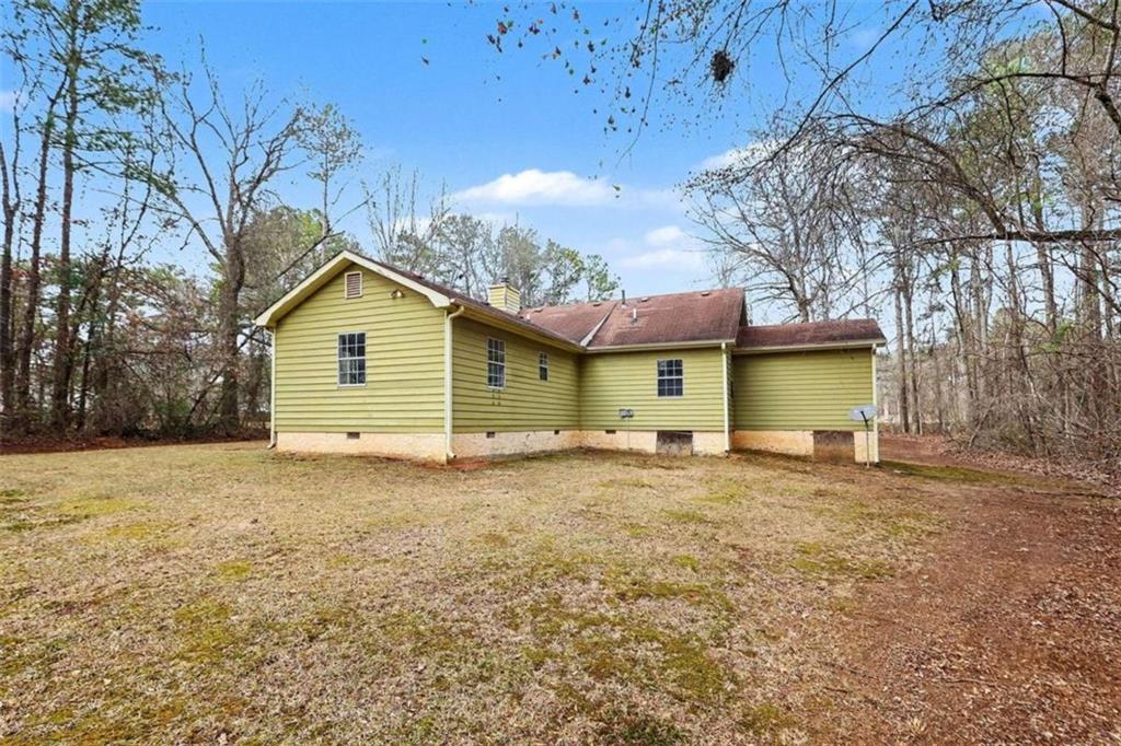 253 Ruth Drive Newnan, GA 30265 - Photo 22 of 25 a view of a house with a yard and garage
