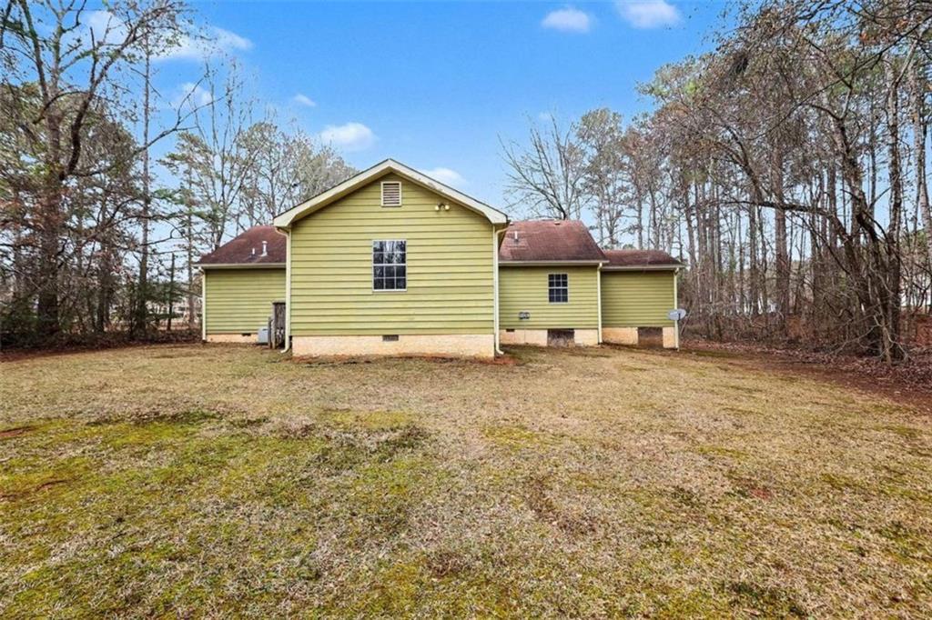 253 Ruth Drive Newnan, GA 30265 - Photo 24 of 25 a view of a house with a yard