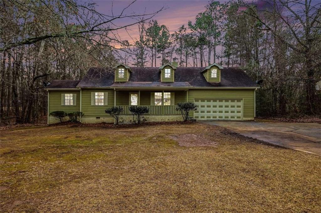 253 Ruth Drive Newnan, GA 30265 - Photo 25 of 25 a front view of a house with a garden