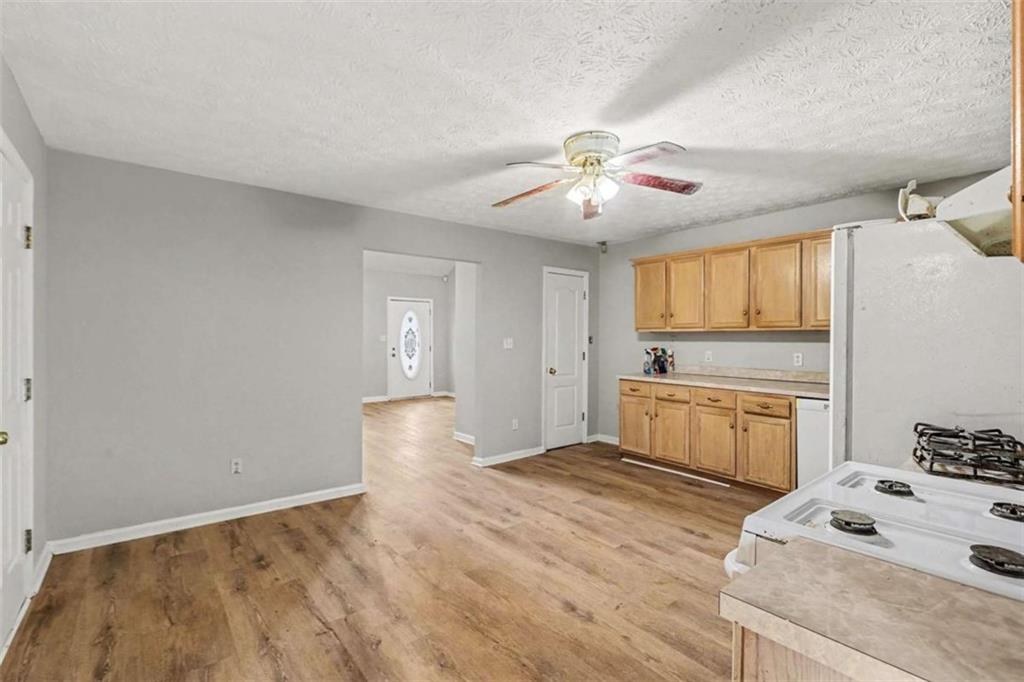 253 Ruth Drive Newnan, GA 30265 - Photo 9 of 25 a bedroom with a bed and a chandelier