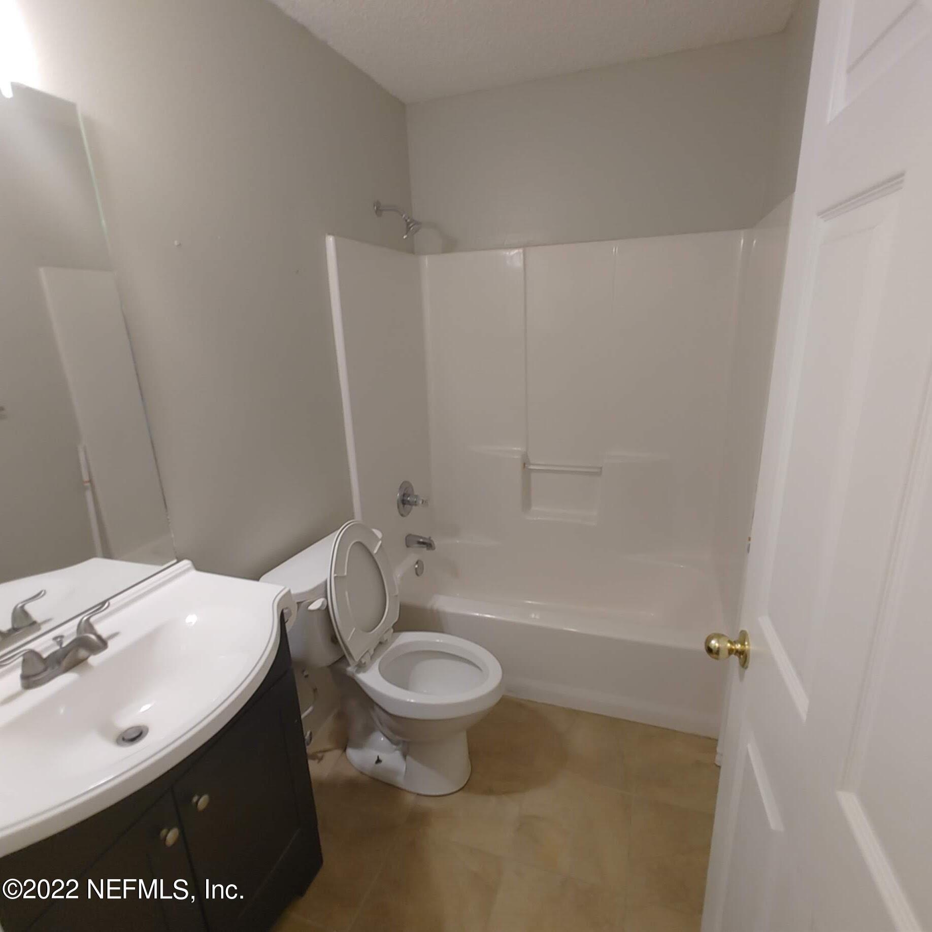 10346 Clayton Mill Road Jacksonville, FL 32221 - Photo 10 of 19 a bathroom with a sink a toilet and shower