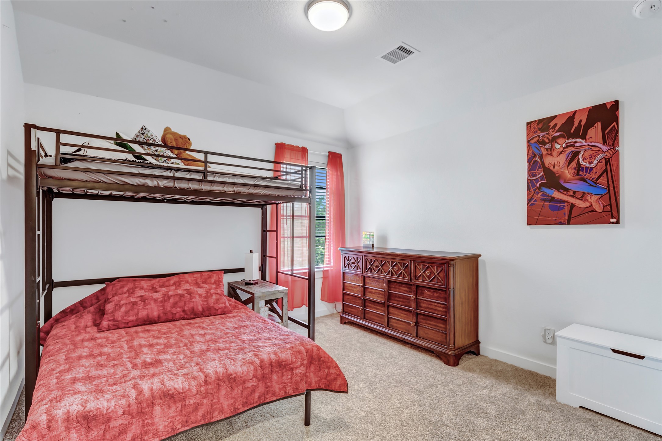 527 Chestnut Reef Court Conroe, TX 77304 - Photo 28 of 40 a bedroom with a bed and a cabinets