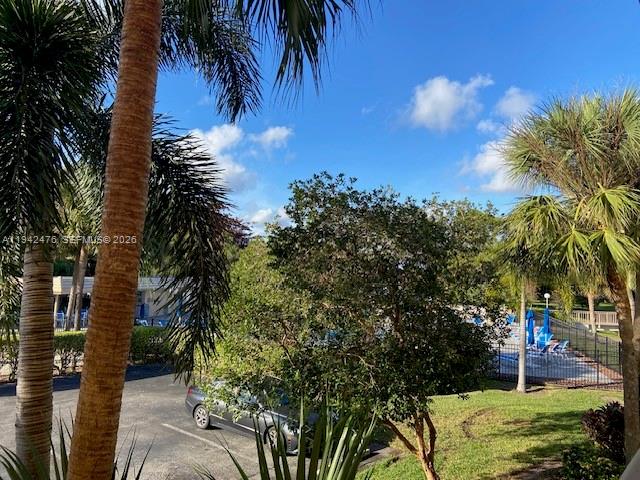 1902 Bermuda Circle, Unit E2 Coconut Creek, FL 33066 - Photo 20 of 30 a view of a yard