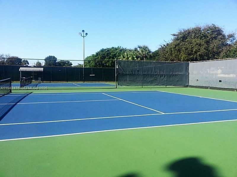 1902 Bermuda Circle, Unit E2 Coconut Creek, FL 33066 - Photo 24 of 30 a view of a tennis court