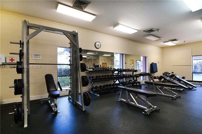 1902 Bermuda Circle, Unit E2 Coconut Creek, FL 33066 - Photo 28 of 30 a view of a room with gym equipment