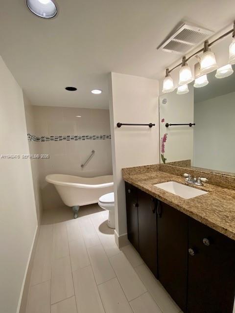 1902 Bermuda Circle, Unit E2 Coconut Creek, FL 33066 - Photo 6 of 30 a bathroom with a sink a toilet and shower