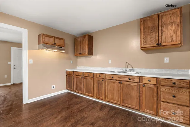 a view of a kitchen with electric appliances